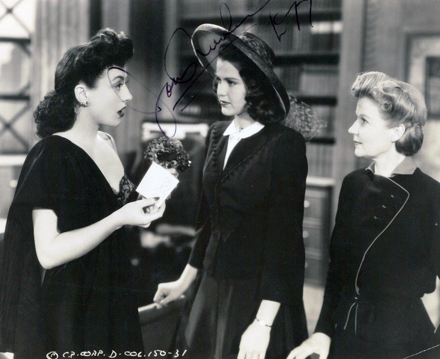 1942. 'They All Kissed the Bride.' With Helen Parrish (center).