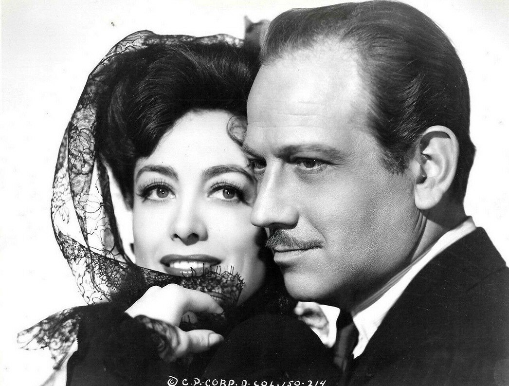 1942. Publicity for 'They All Kissed the Bride' with Melvyn Douglas.