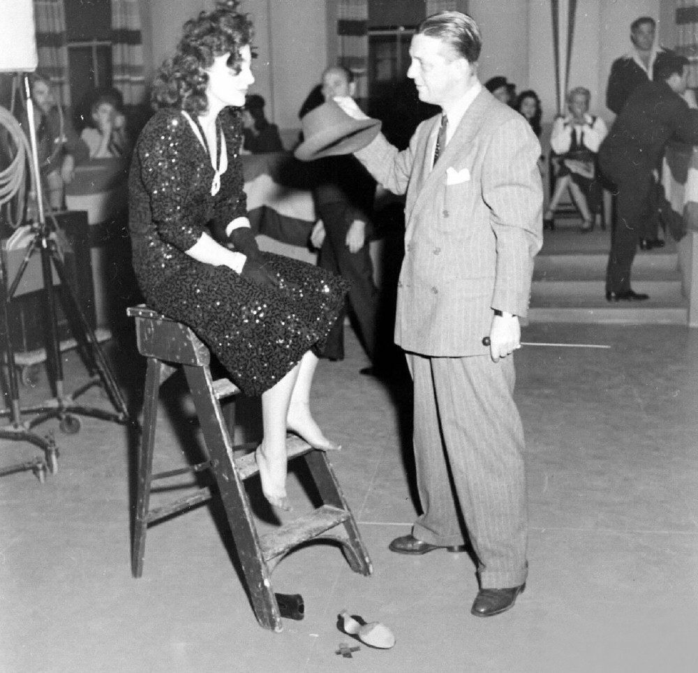 1942. On the set of 'They All Kissed the Bride' with director Alexander Hall.