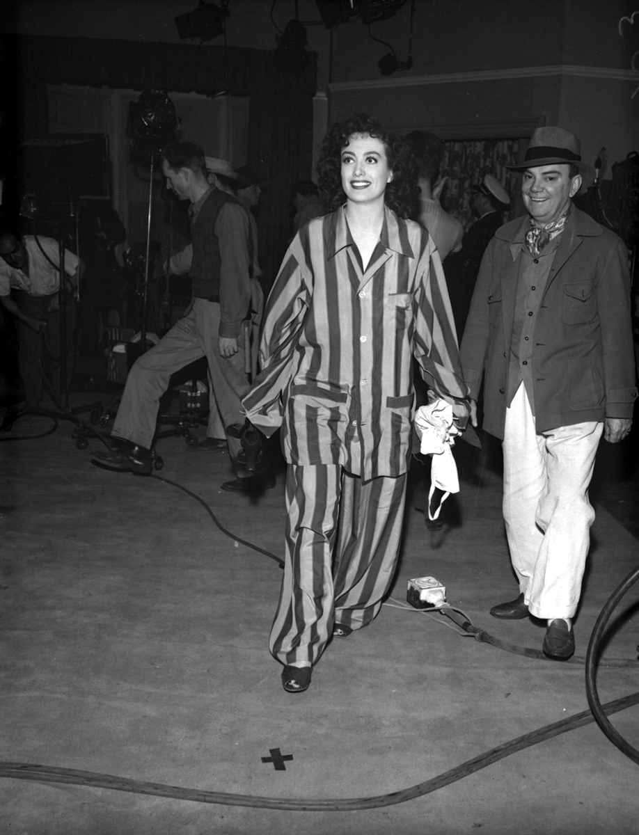 1942. On the set of 'They All Kissed the Bride' with Cliff Edwards.