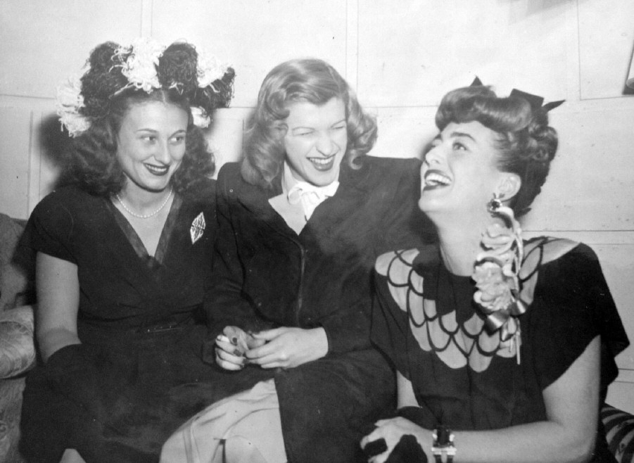 1945. At a Warners reception for Joan at NYC's Sherry-Netherland hotel. With Nancy Walker (center).