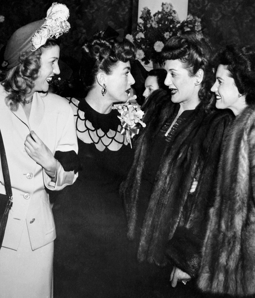 1945. At a Warners reception for Joan at NYC's Sherry-Netherland. With the Andrews Sisters.