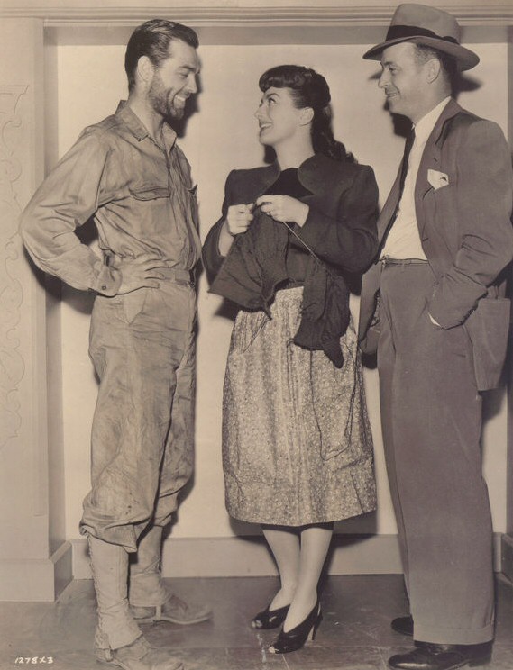 1943. On the set of 'Above Suspicion' with husband Phillip Terry, left, and director Richard Thorpe.