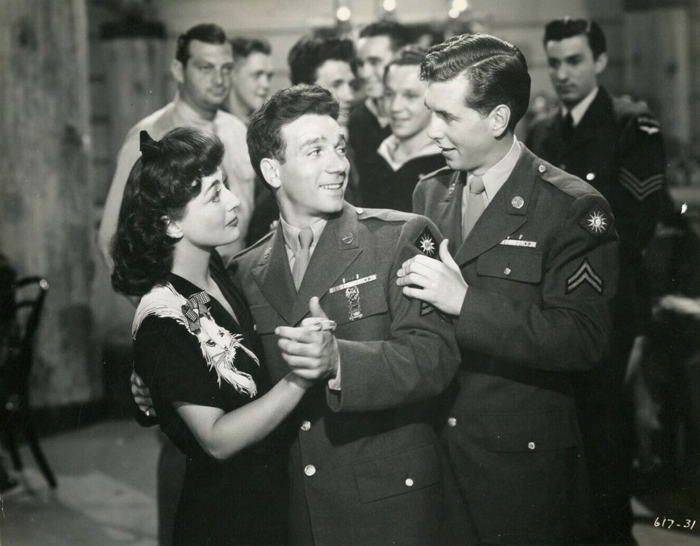 1944. Film still from 'Hollywood Canteen' with Dane Clark and Robert Hutton.