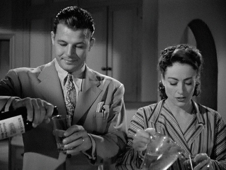 1945. 'Mildred Pierce' screen shot with Jack Carson.