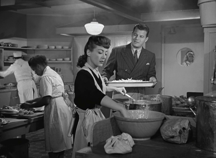 1945. Screen shot from 'Mildred Pierce' with Butterfly McQueen and Jack Carson.