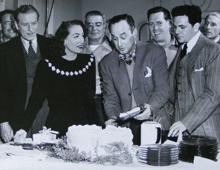 1946. On the set of 'Humoresque' with Negulesco, Garfield, other cast and crew.