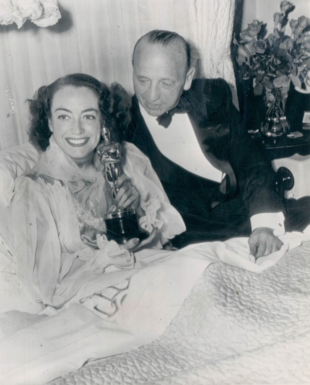 March 7, 1946. At home with Oscar and director Mike Curtiz.