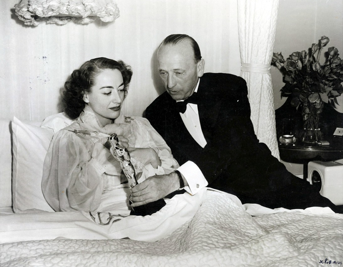 3/7/46. At home with the Oscar and director Mike Curtiz.