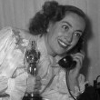 3/7/46. At home with her new Oscar for 'Mildred Pierce.'