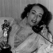 3/7/46. At home with her new Oscar.