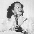 3/7/46. Joan greets the press at home after winning the Oscar for 'Mildred.'