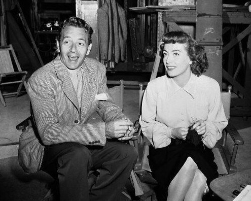 1947. On the set of 'Possessed' with Paul Henreid.