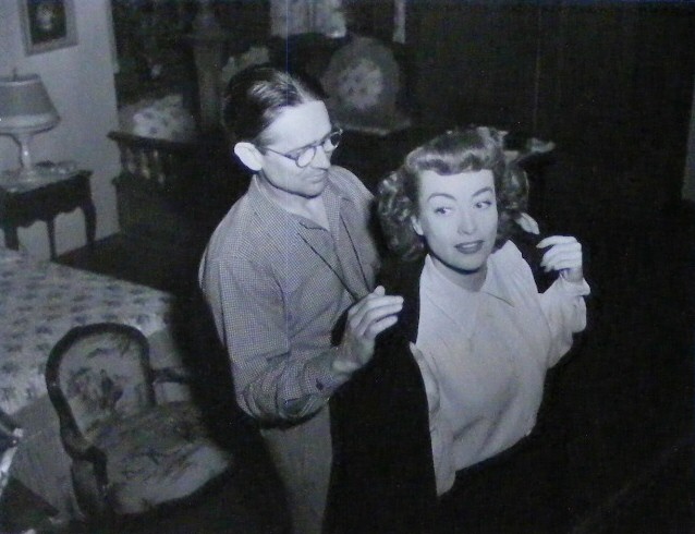 1947. On the set of 'Possessed' with cameraman Sidney Hickox.