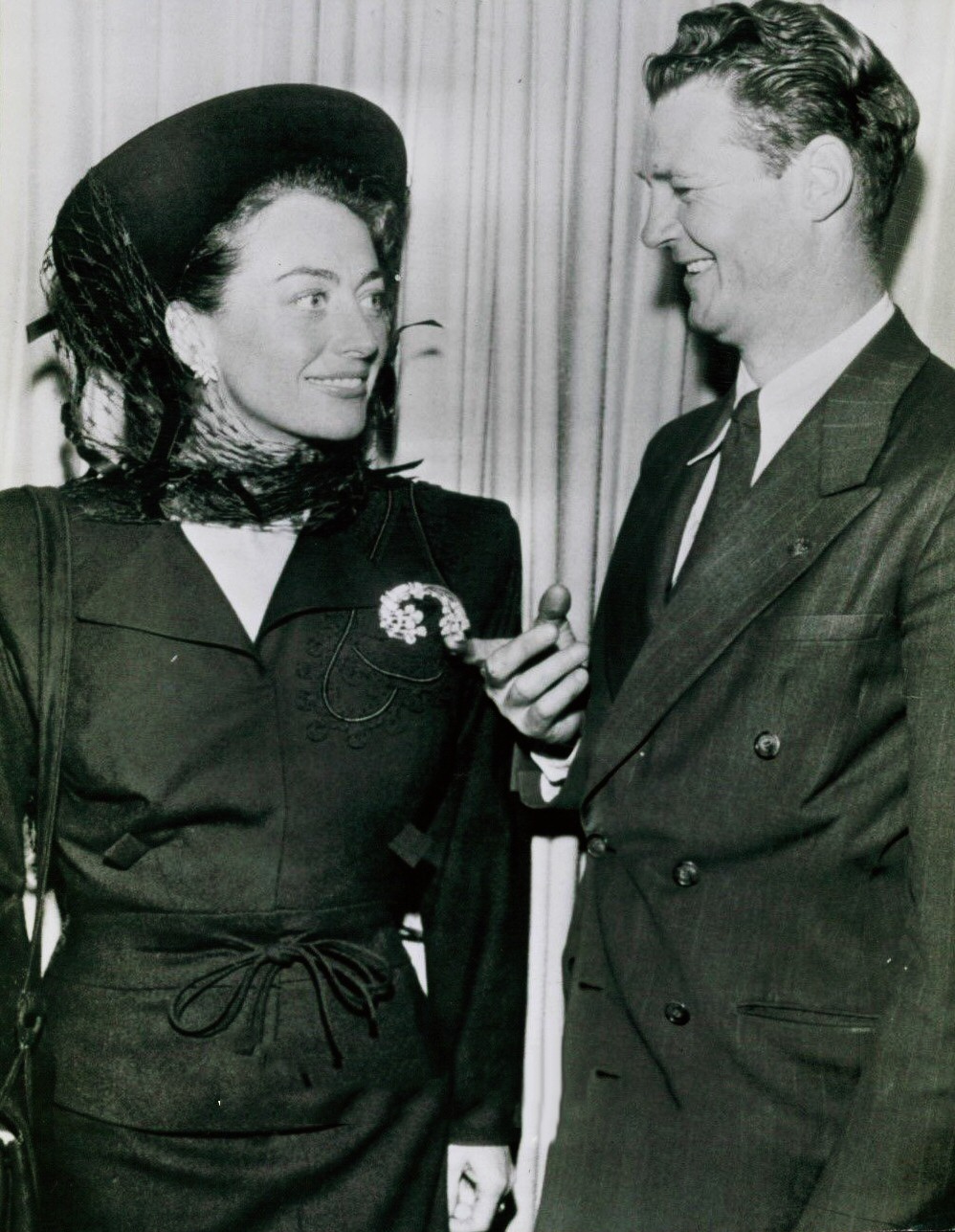 May 1948. With the detective who returned Joan's $50,000 brooch lost at Slapsy Maxie's.
