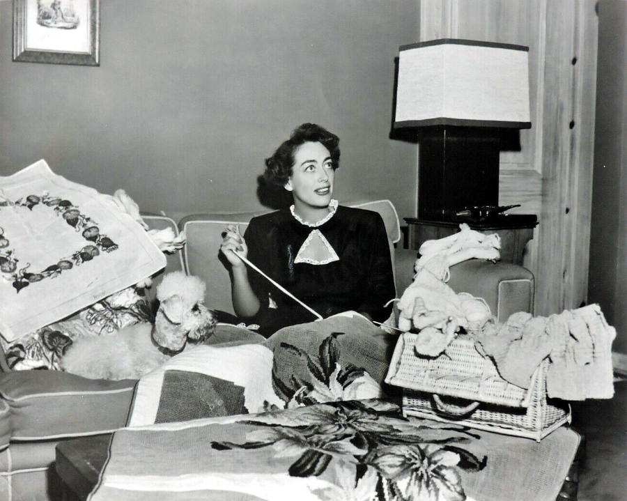 1949. Joan doing needlework at home.