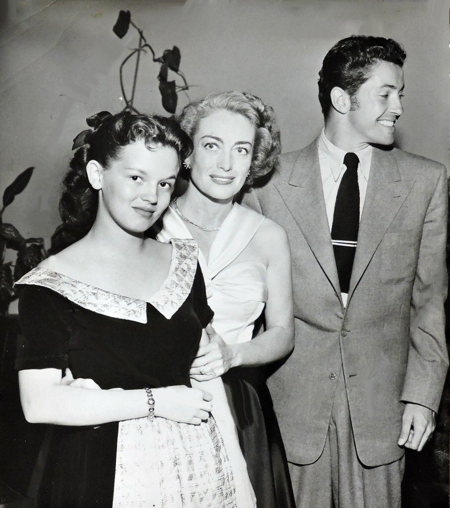 1949. With goddaughter Joan Evans and Farley Granger.