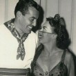 October 1949. At the Photographers Ball at Ciro's with Cesar Romero. (Includes press caption.)