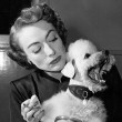 1950. On set of 'Damned Don't Cry' with Cliquot.