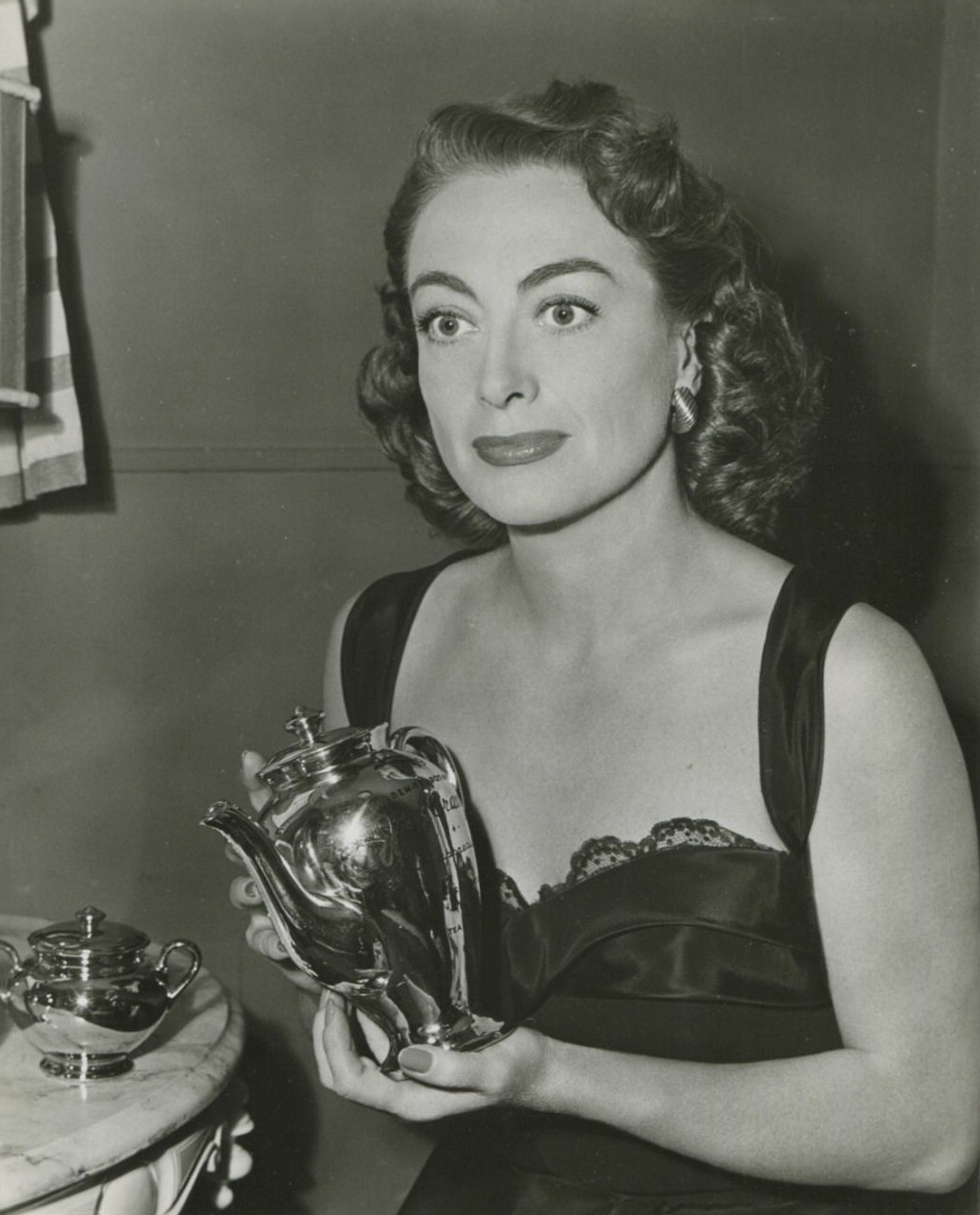 1950. Winner of the 'Golden Teapot' award on the set of 'Damned Don't Cry.'