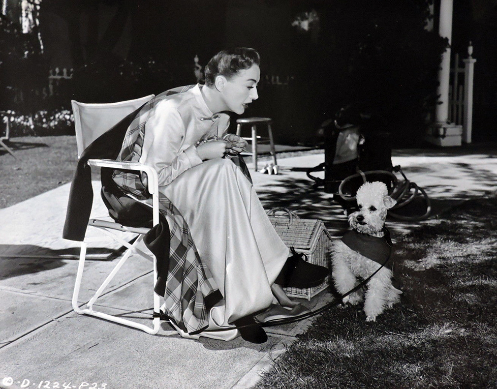 1950. On the set of 'Harriet Craig' with Cliquot.