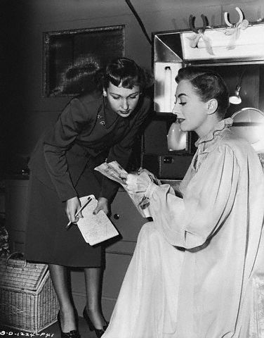 1950. On the set of 'Harriet Craig.'