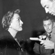 At the 1950 premiere of 'Breakthrough,' interviewed by 'Armed Forces' reporter. (Includes press caption.)