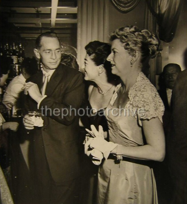 1954. With ex-husband Franchot Tone and Betty Furness.