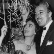 January 1953 with Cesar Romero at party for oilman Tevis Morrow. Shot by Dallinger. Includes press caption.