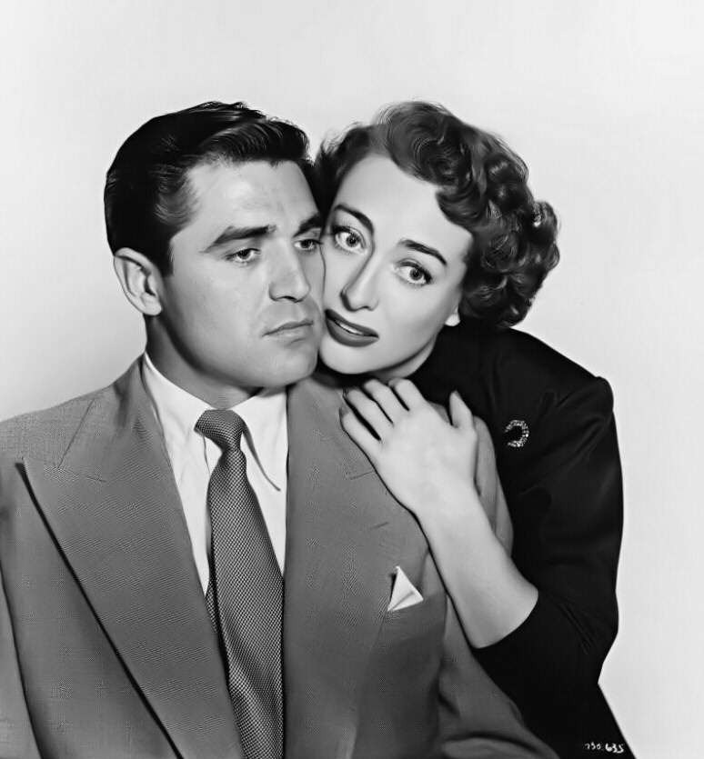 1950. 'This Woman Is Dangerous.' With Steve Cochran. (More-airbrushed version of same photo below.)