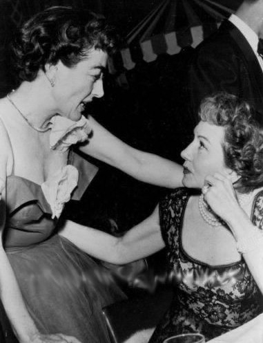 1953. With Claudette Colbert at Romanoff's.