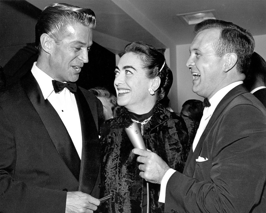 1954. With George Nader, left, and Johnny Grant.