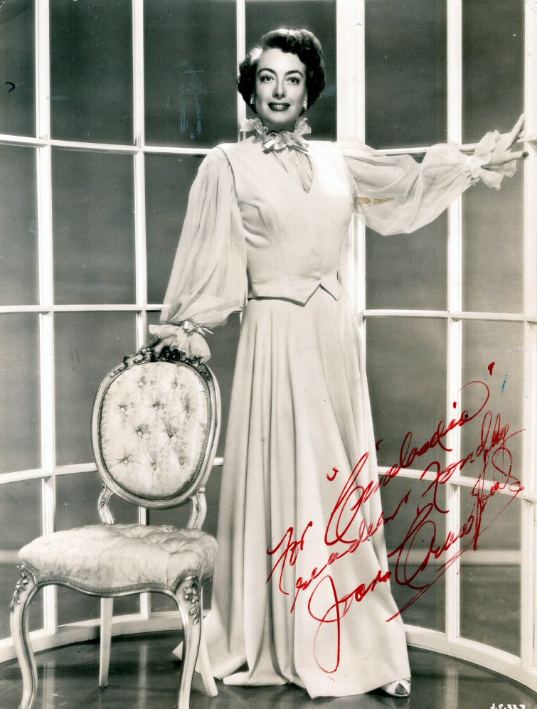 1952. 'This Woman Is Dangerous' publicity shot by Bert Six. Autographed.
