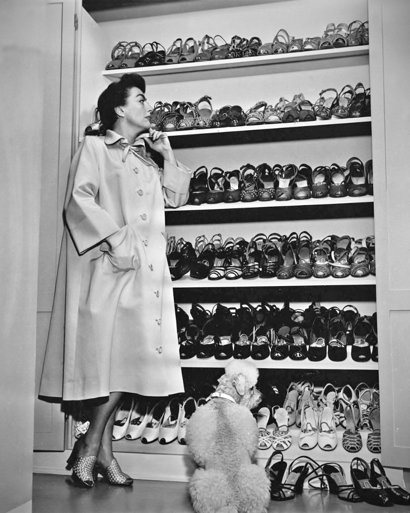 Circa 1950. At home with shoes and Cliquot.