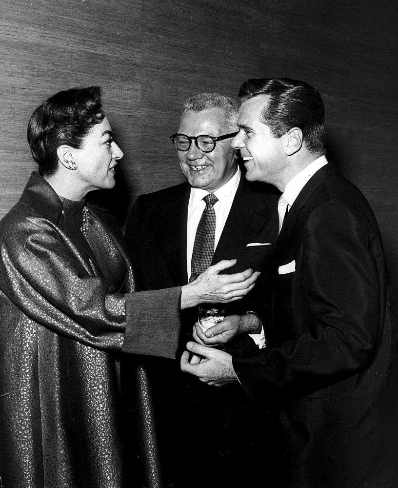 October 1955. At a Hollywood event with husband Al Steele, center, and Jackie Cooper.