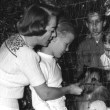 1950. At home with Christopher, Cliquot, and neighbor kids and dog.