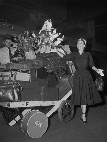 August 2, 1952. Joan and luggage at Grand Central Station.