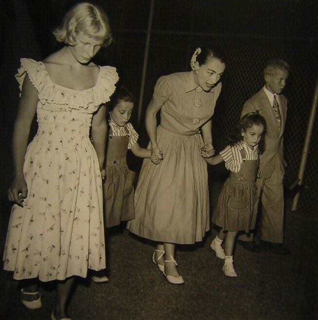 1953. On a frog hunt with the kids.