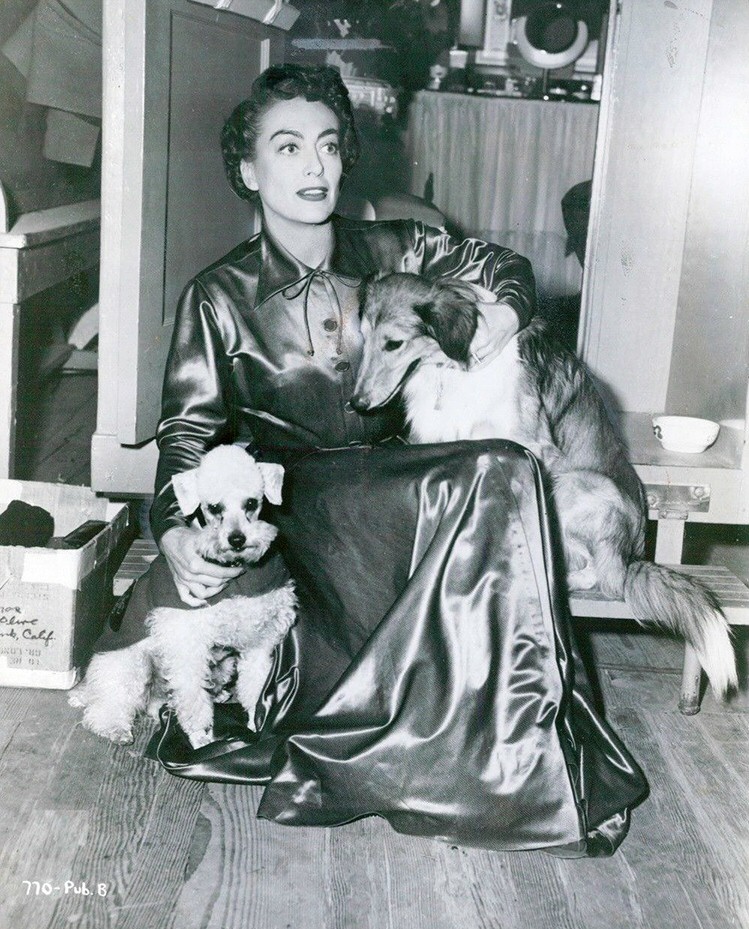 1952. On the set of 'This Woman Is Dangerous' with Cliquot and friend.