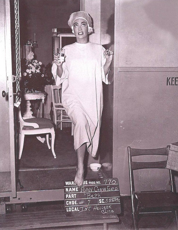1952. On the set of 'This Woman Is Dangerous.'