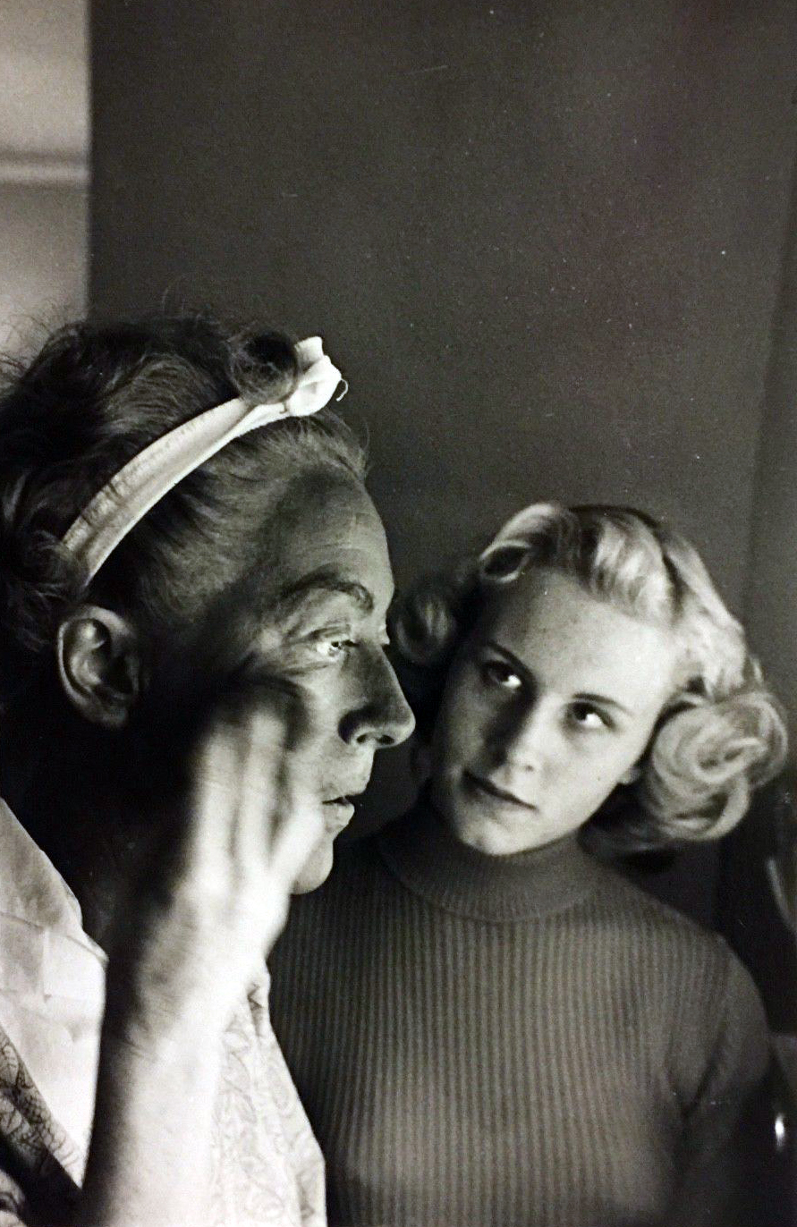 1953. Applying blackface on the set of 'Torch Song,' with Christina looking on. Shot by Sanford Roth.