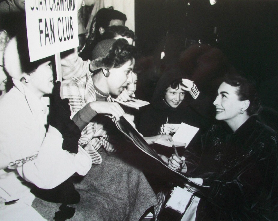 November 1953. With fan-club members at the premiere of 'Torch Song.'