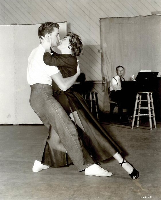 1953. On the set of 'Torch Song' with dancer Mark Wilder.