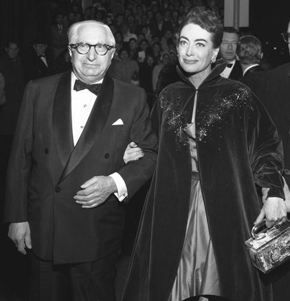 November 1953. At the 'Torch Song' premiere with former MGM head Louis B. Mayer.