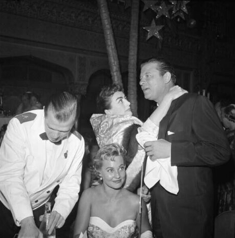 1954. With Jack Carson and Lola Albright at 'Star Is Born' premiere.