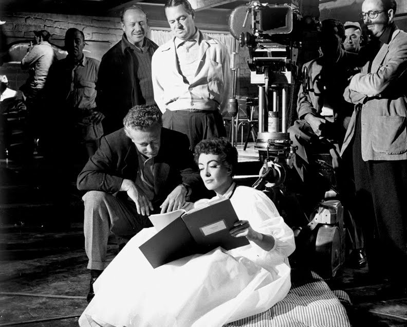 1954. 'Johnny Guitar.' On the set with director Nick Ray.