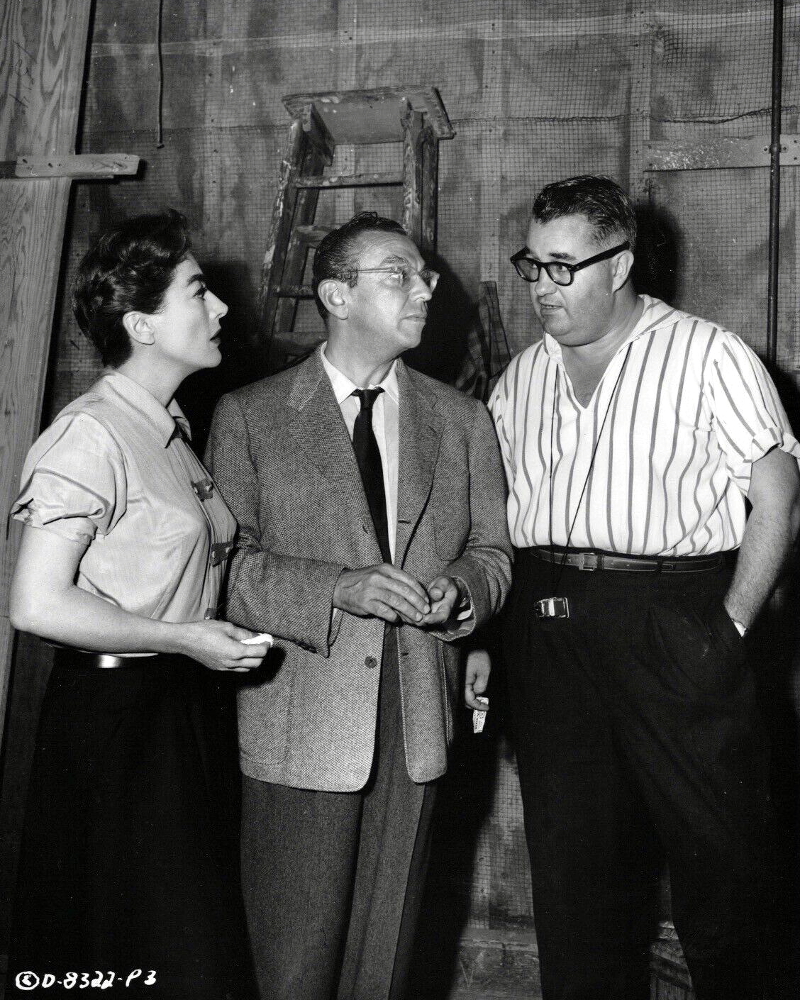 1956. On the set of 'Autumn Leaves' with director Aldrich, right.