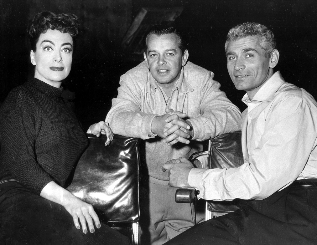 1955. On the set of 'Female on the Beach' with director Joseph Pevney and Jeff Chandler.