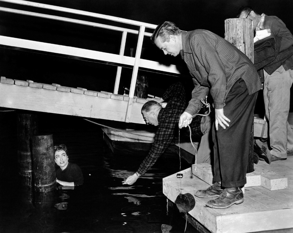 1955. On the set of 'Female on the Beach.'