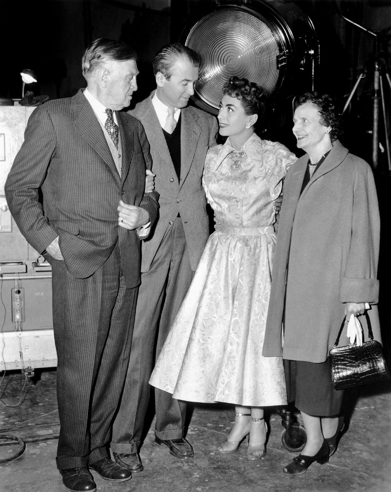 12/31/54. With James Stewart and his father on the set of 'Female on the Beach.'